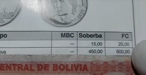 Imagem de um catálogo de numismática mostrando os valores de uma moeda prova de 1 cruzado nas condições MBC, Soberba e Flor de Cunho.