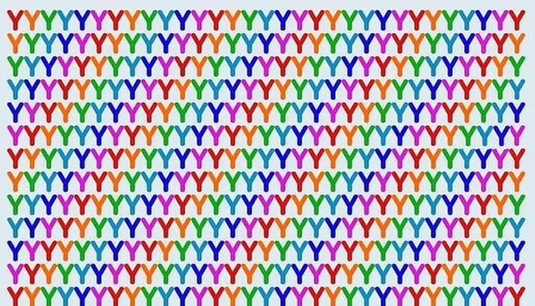 Desafio visual com várias letras 'Y' dispostas em padrão repetitivo nas cores do arco-íris, formando uma sequência visual de formas vibrantes